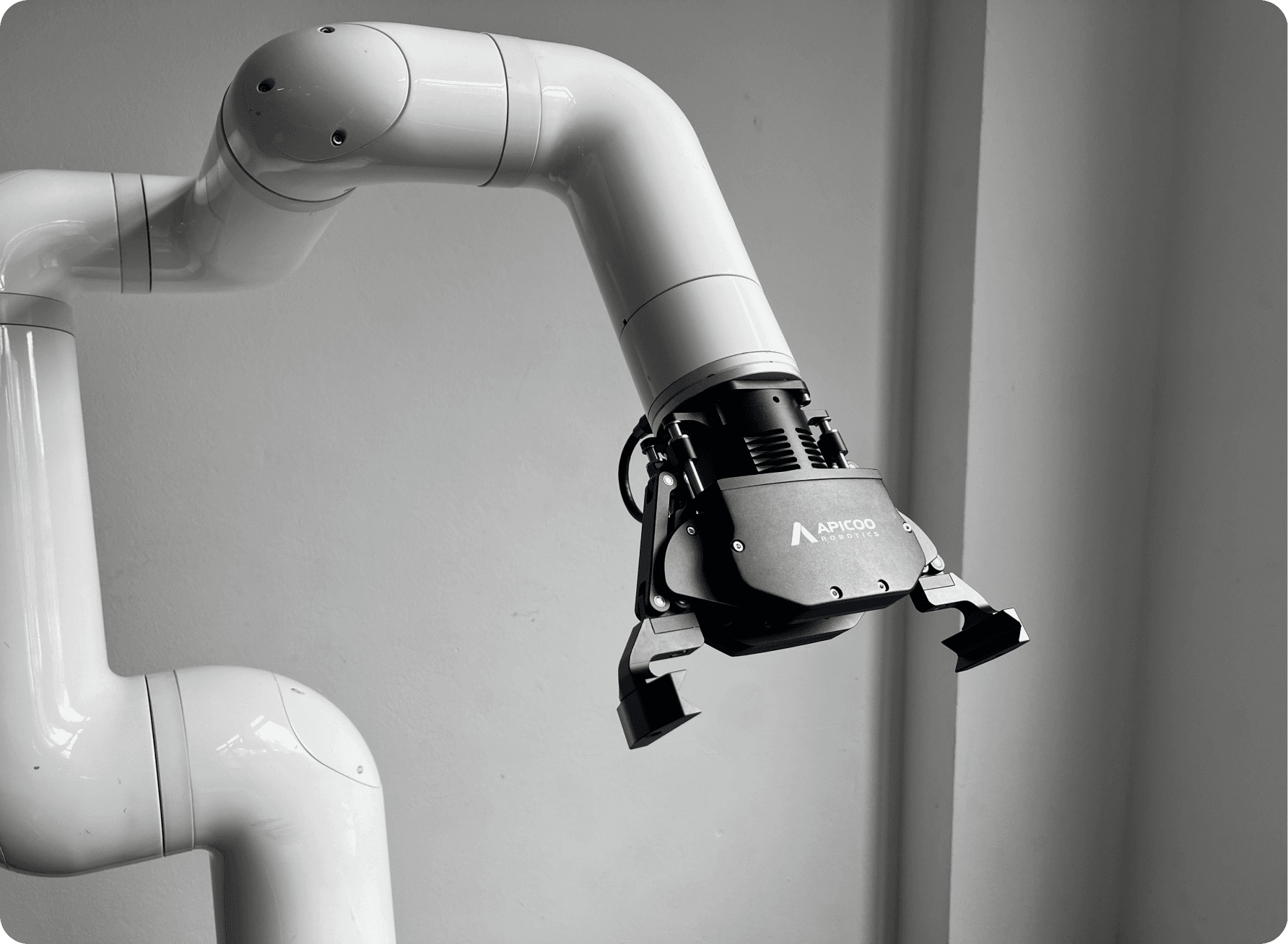 Close-up of a SusGrip gripper mounted on a robot arm in a factory