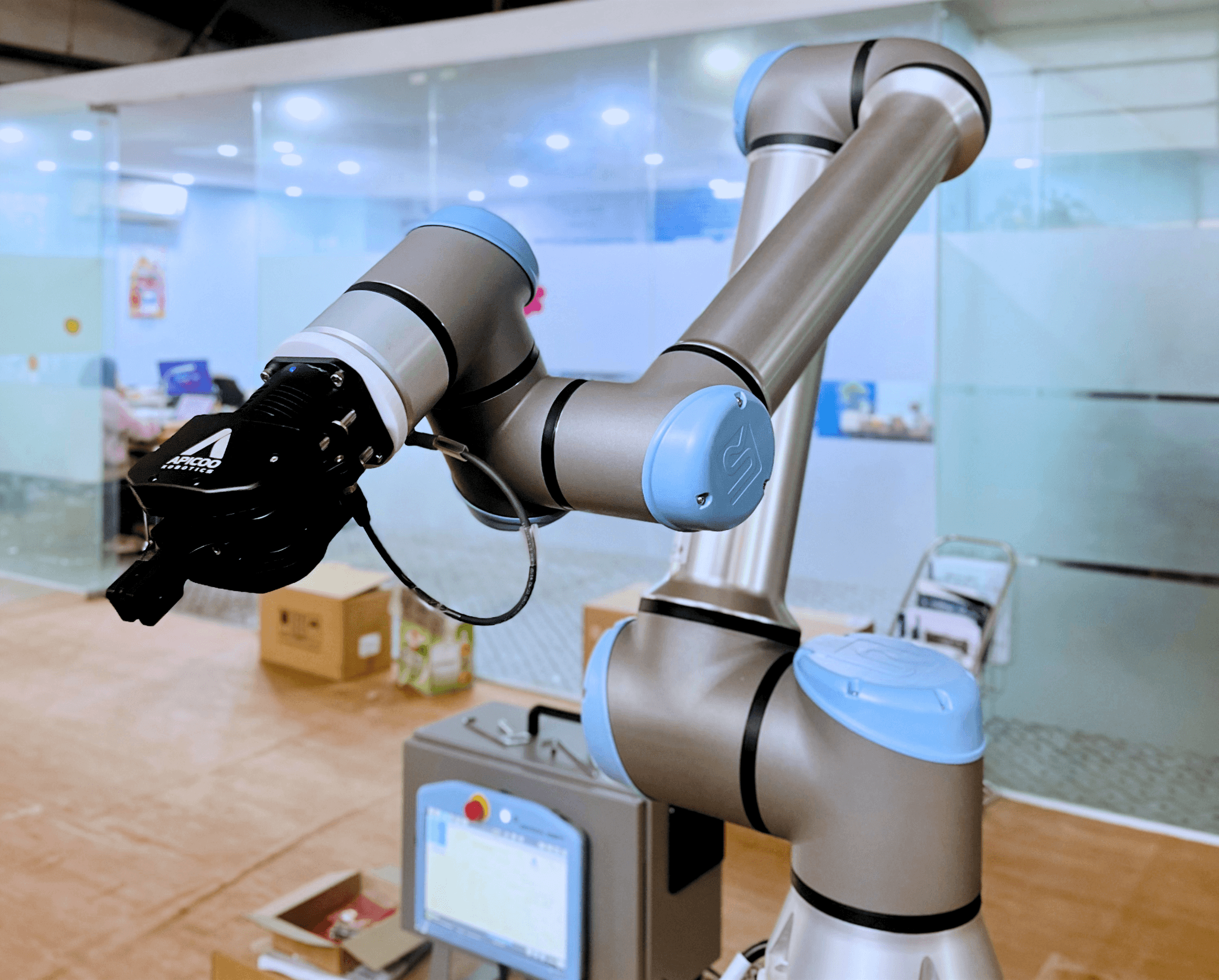 SusGrip 3F mounted on a collaborative robot arm at a machine tending bench