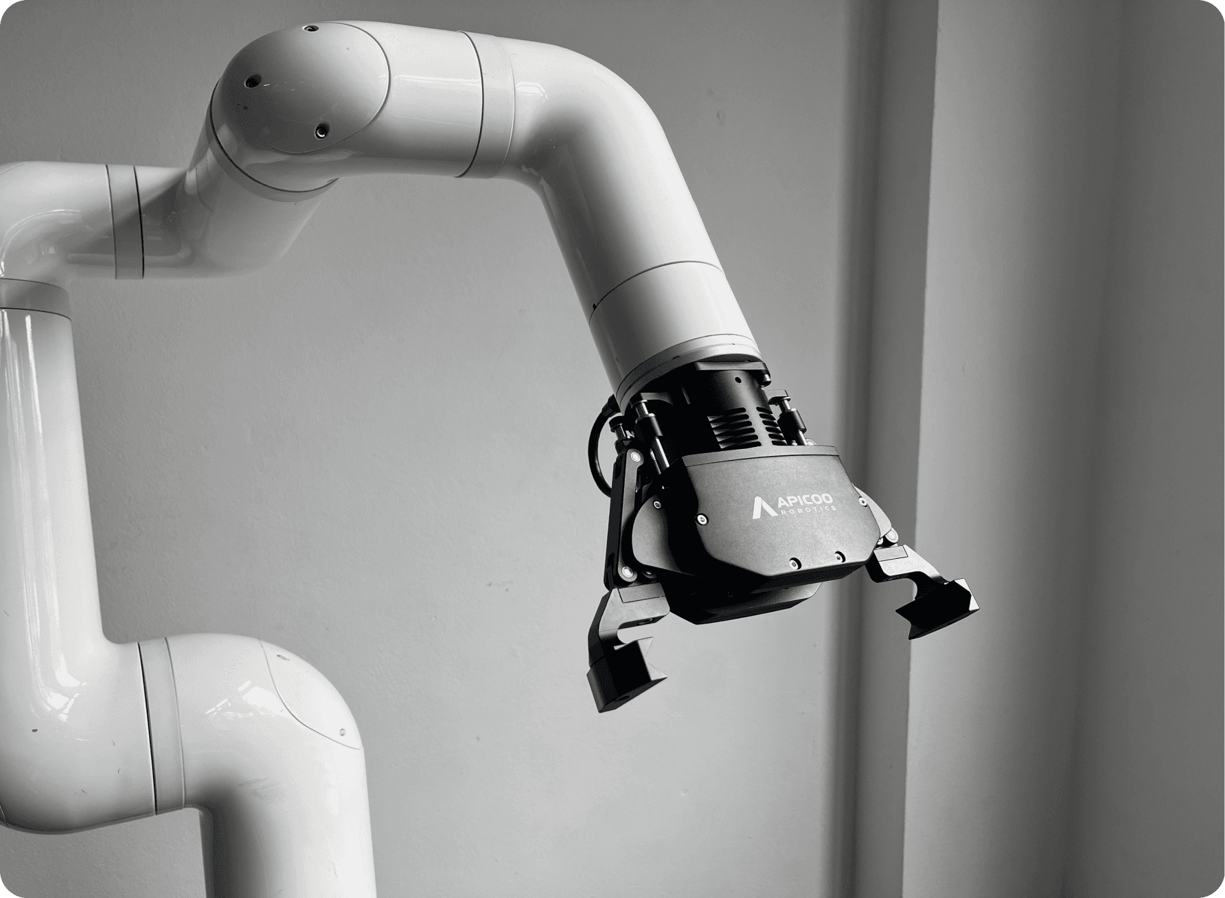 Close-up of a SusGrip gripper mounted on a robot arm in a factory